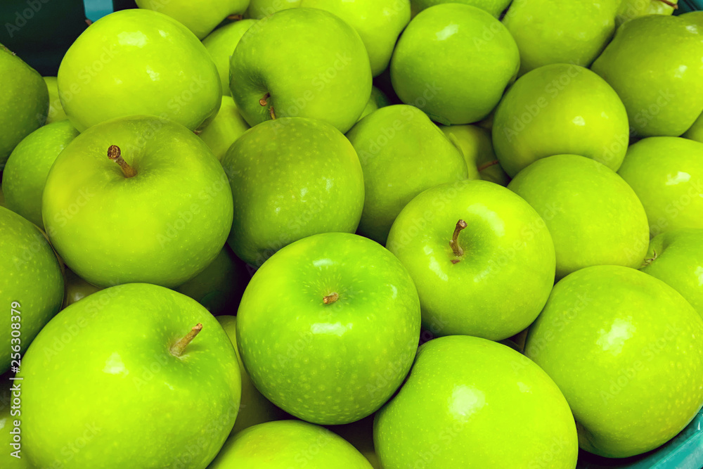A pile of green apples as background, texture (Granny Smith) A pile of green apples as background, texture (Granny Smith)