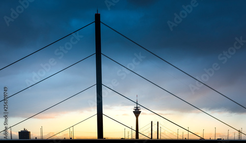 Germany, Duesseldorf, Oberkassel Bridge with television tower in the background at twilight photo