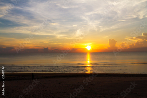 Sunrise on sea and shadow on baech at beach