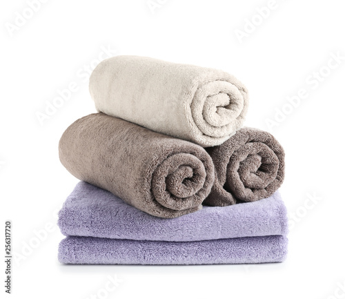 Stack of fresh towels isolated on white