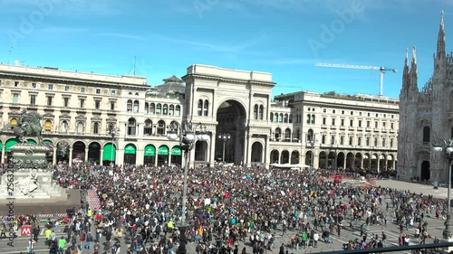 View of Duomo square full of people during global strike demonstration, Friday for future parade, Milan, Italy. Crowd picketing for to protecting the planet, sit in of protester for green activism