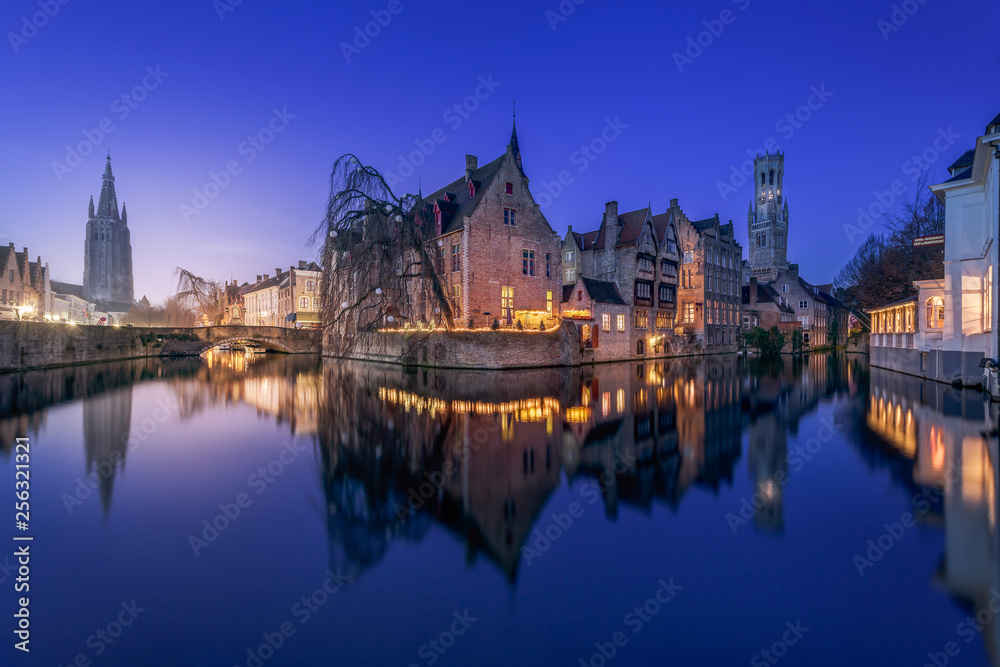 Belgium, Bruges, canal waterfront and historic buildings at night Belgium, Bruges, canal waterfront and historic buildings at night