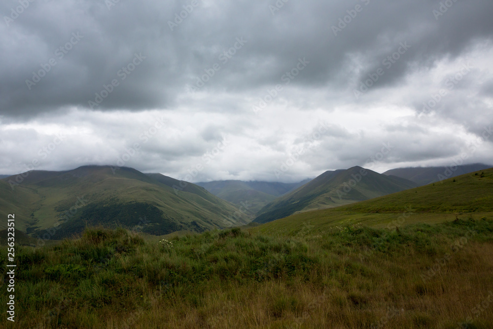 Mountains of the North Caucasus, mountain tops in clouds. Wild nature Mountains of the North Caucasus, mountain tops in clouds. Wild nature