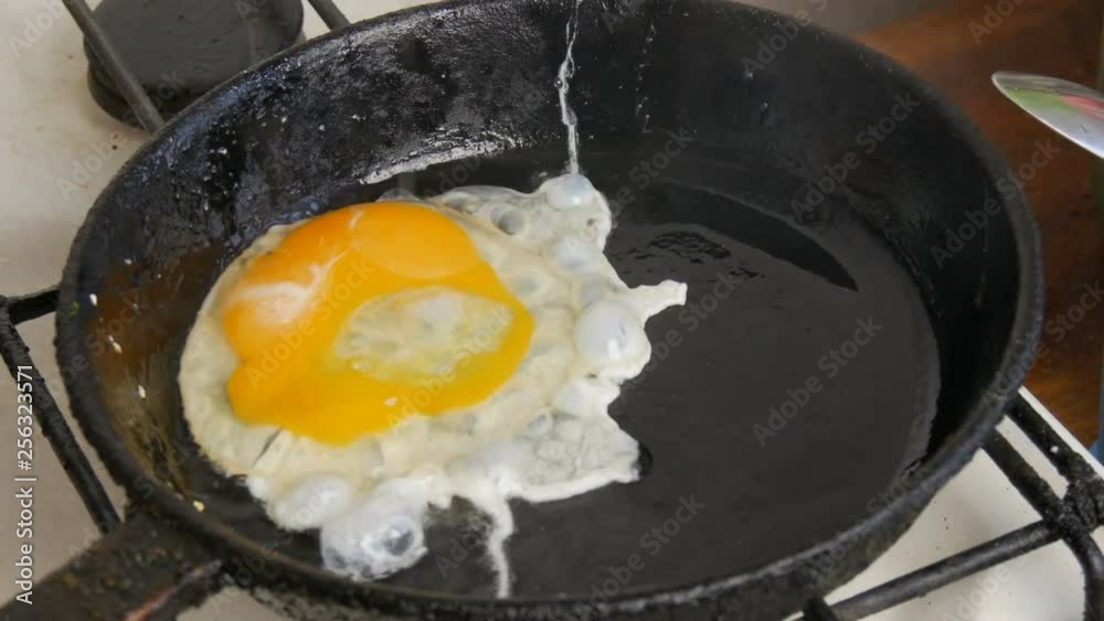 Small quail eggs break into a pan for fried scrambled eggs Small quail eggs break into a pan for fried scrambled eggs