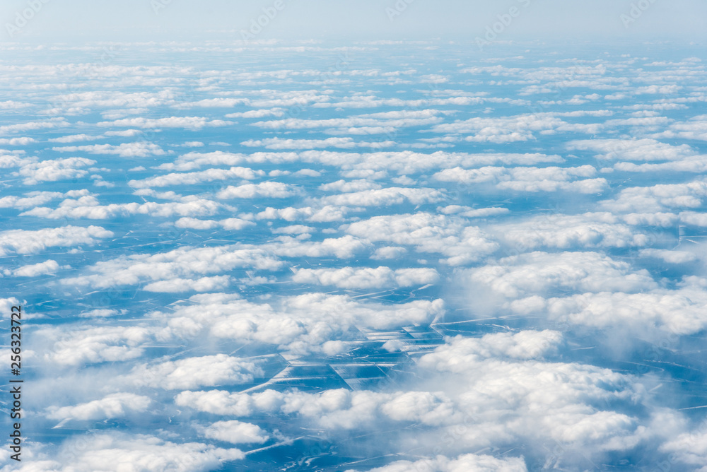 Top view of white clouds above the ground or water Top view of white clouds above the ground or water