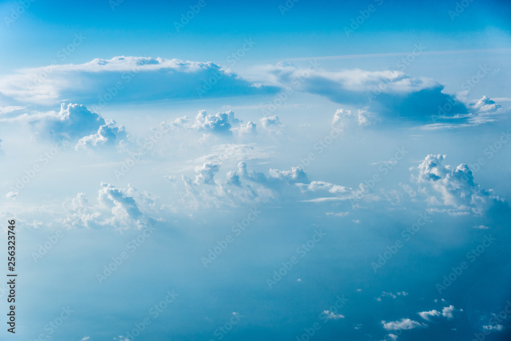 Top view of white clouds above the ground or water Top view of white clouds above the ground or water
