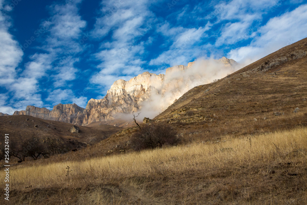 Mountains of the North Caucasus, mountain tops in clouds. Wild nature