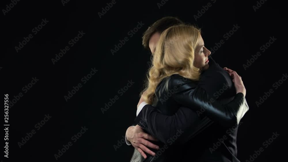 Man and woman hugging, warm meeting of two old friends, togetherness and support Man and woman hugging, warm meeting of two old friends, togetherness and support