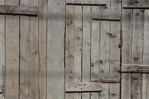 gray wooden texture from old planks in the wall