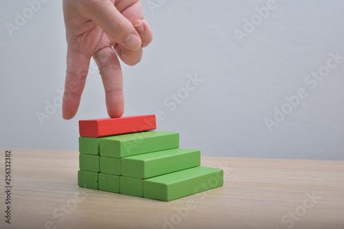 wrong step Wooden blocks ladder and fingers career path