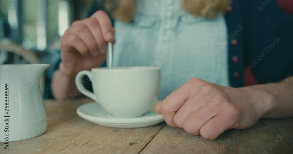 Young woman drinking coffee in a cafe Young woman drinking coffee in a cafe