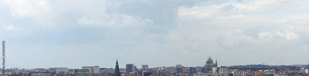 Panoramic view on Brussels skyline on a cloudy march afternoon with Koekelberg basilica in prominent position