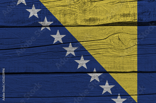 Bosnia and Herzegovina flag painted on old wood plank