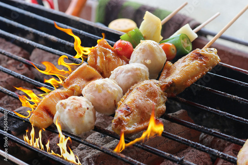 Colorful seafood skewers on the grill