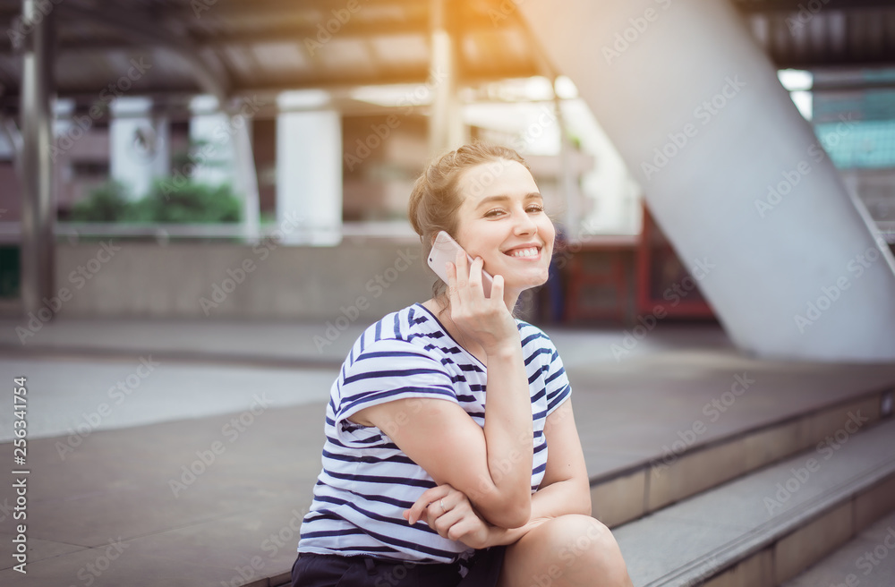 Beautiful caucasian young women using smart phone to her boyfriend,Positive thinking,Happy and smiling