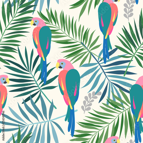 Seamless repeat pattern with tropical leaves and colorful ara parrots in sophisticated colors