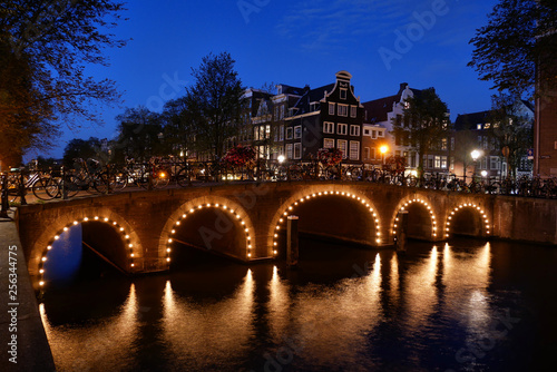 Charming evening lights on an Amsterdam canal bridge