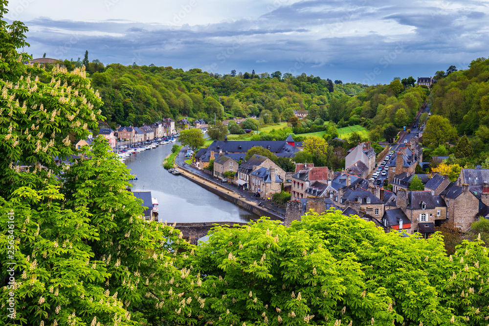 Aerial view of the historic town of Dinan with Rance river with dramatic cloudscape, Cotes-d'Armor department. Brittany (Bretagne), France