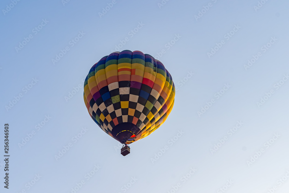 Naklejka premium Hot air balloons flying on the blue sky during sunrise in morning..