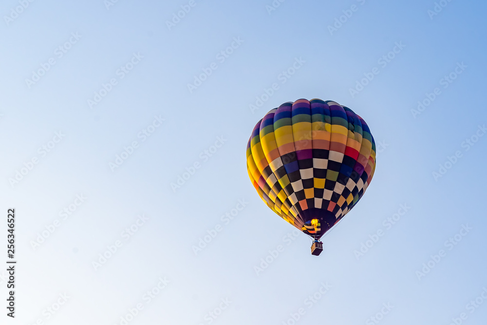 Naklejka premium Hot air balloons flying on the blue sky during sunrise in morning.
