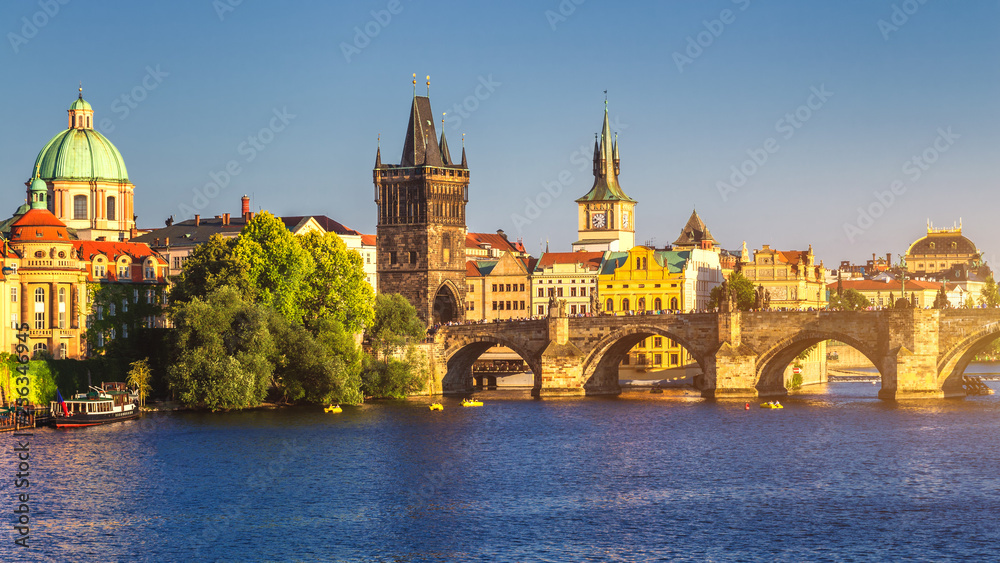 Famous Charles bridge in the sunset light, beautiful scenary and one of the iconic landmarks in Prague. Czech Republic.