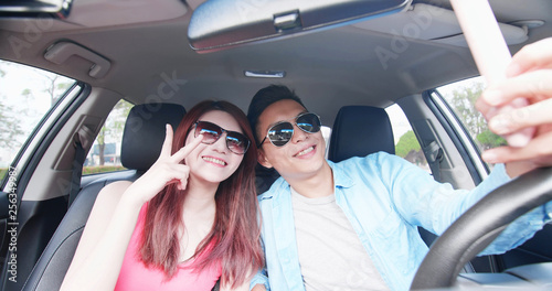 couple take selfie in car © ryanking999