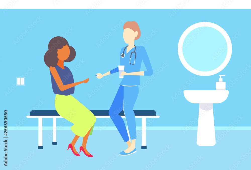 female doctor giving medications pills to african american woman patient consultation medicine and healthcare concept clinic room interior flat horizontal