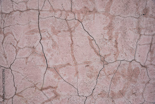 A lot of cracks on the concrete wall texture