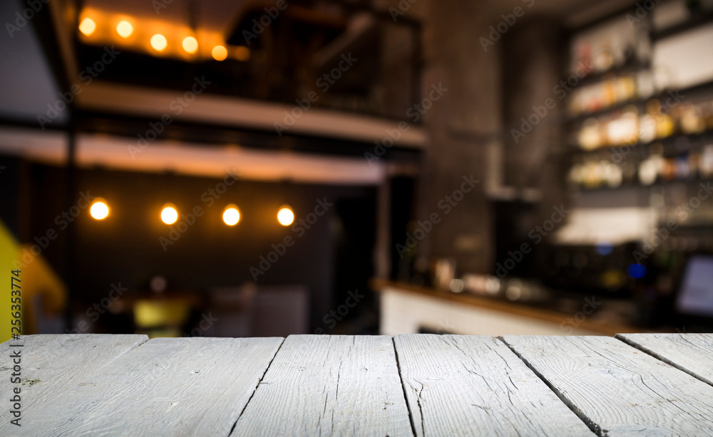 blurred background of bar and dark brown desk space of retro wood blurred background of bar and dark brown desk space of retro wood