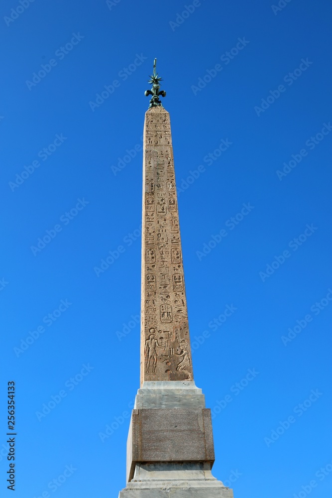 Fototapeta premium Ancient Egyptian obelisk with hieroglyphs that tell the story of