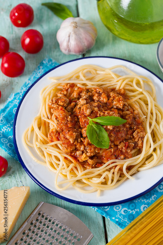 spaghetti bolognese on wooden surface