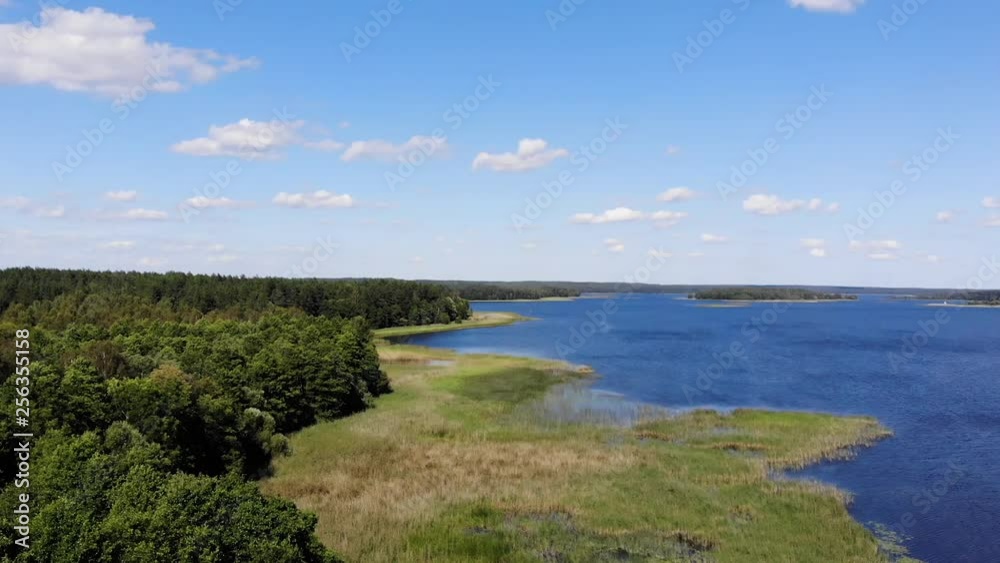 AERIAL: Still Shot of the Beautiful Blue Color Lake With Wind Making Ripples on the Surface of Lake AERIAL: Still Shot of the Beautiful Blue Color Lake With Wind Making Ripples on the Surface of Lake