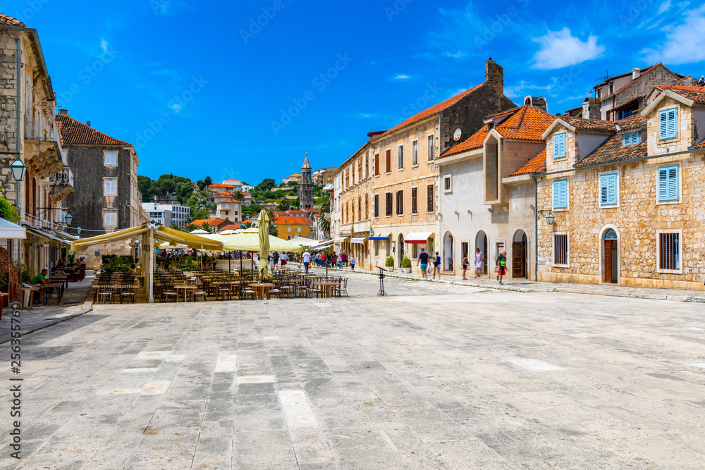 Main square in old medieval town Hvar. Hvar is one of most popular tourist destinations in Croatia in summer. Central Pjaca square of Hvar town, Dalmatia, Croatia.