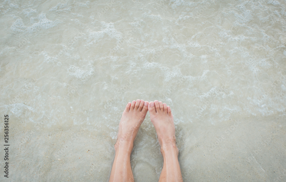 Woman leg on beach in holiday,selective focus. Woman leg on beach in holiday,selective focus.