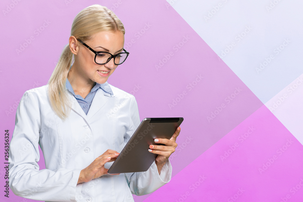female doctor using her digital tablet