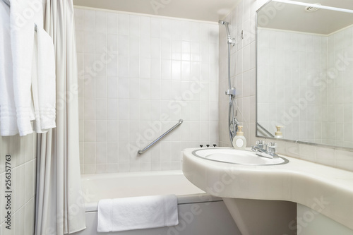 White bath tub in modern small bathroom