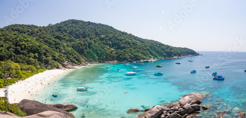 Top view Similan Islands as a tourist destination featured in the beauty under the sea the boat to take tourists snorkeling around the island. © piyaphunjun