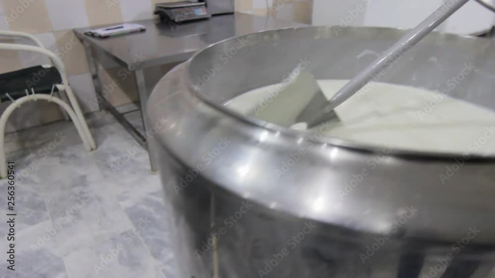 Milk processing in a machine, Close up view Milk processing in a machine, Close up view