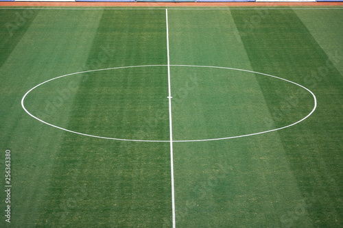 Aerial view of natural beautiful pattern of fresh green grass soccer field background. Football stadium.