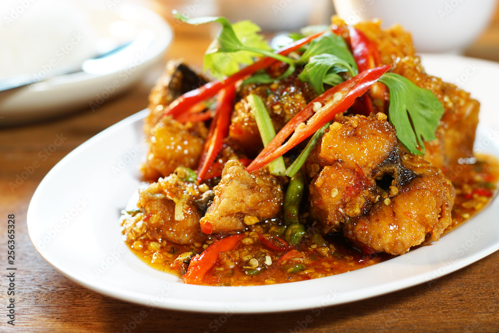 Fried fish with sweet chilli sauce served with steamed rice, Selective focus. Still life shoot in studio, Clean food good taste idea concept. Fried fish with sweet chilli sauce served with steamed rice, Selective focus. Still life shoot in studio, Clean food good taste idea concept.
