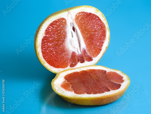 Ripe grapefruit on turquoise background