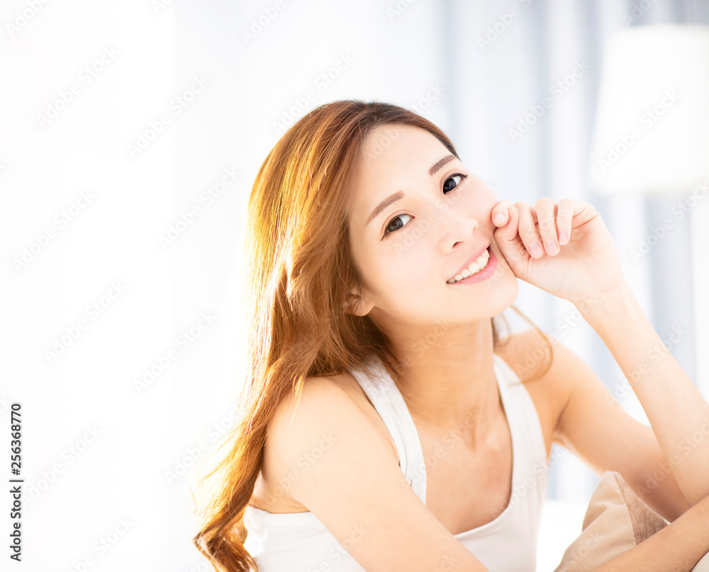 Young beautiful woman sitting on sofa Young beautiful woman sitting on sofa