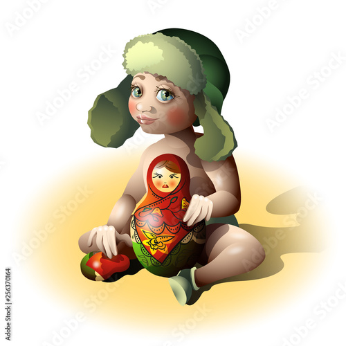 Cute baby plays with a Russian doll