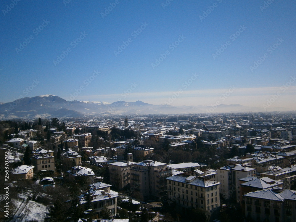 Fototapeta premium Winter Bergamo at the foot of the mountains