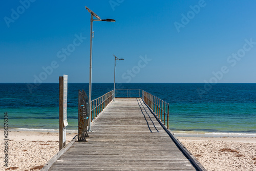 The iconic Normanville jetty with no people and blue skies on a bright sunny day on the Fleurieu Peninsula South Australia  on 20th March 2019
