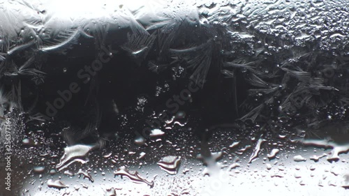 the appearance of a frosty pattern on the glass
