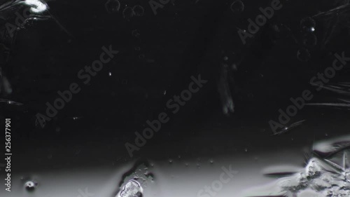 frost draws a pattern on the glass against the background of the snow