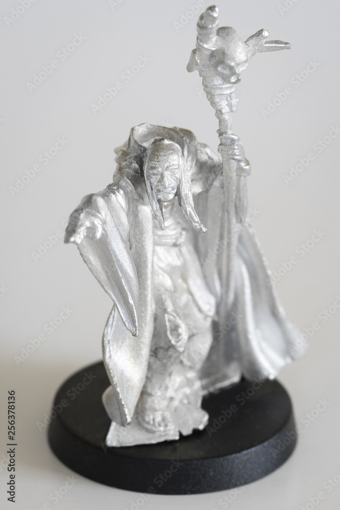 Shaman with stick - tin figure.