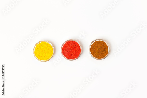 Condiments and herbs on white background. Flat lay. Top view.