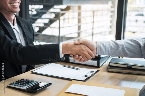 Handshake after finishing conversation Businessman sending a resignation letter to employer boss in order to resign dismiss contract, changing and resigning from work concept